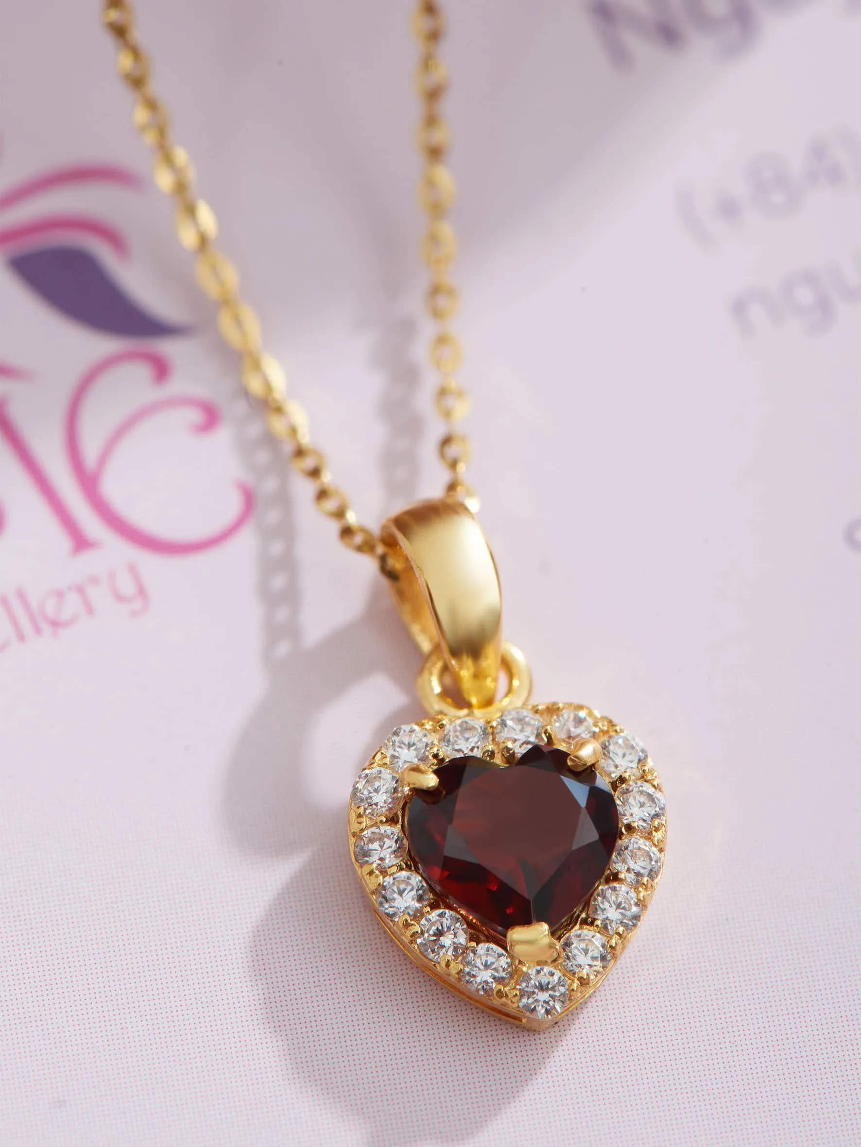 6mm Heart-cut Red Garnet Halo Pendant in 14K Yellow Gold
